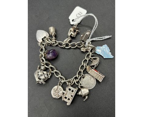 A silver charm bracelet 7 inch 59 gms