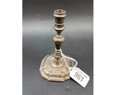 A George II taper stick with shaped square base, baluster stem, 4” high, possibly 1778, by GS query with lion