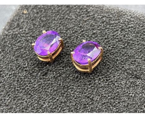 A pair of oval cut statement amethyst stud earrings 9ct 4.4 gms