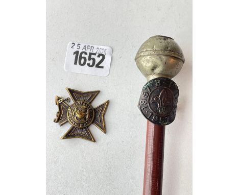 A baton with Army Cadet Force crest,  a badge in a Scouts ring