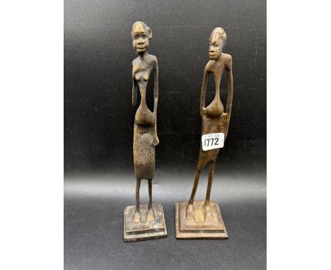 A pair of African bronze figures, 11” high