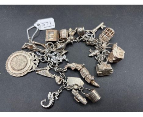 A silver charm bracelet 7 inch 85 gms