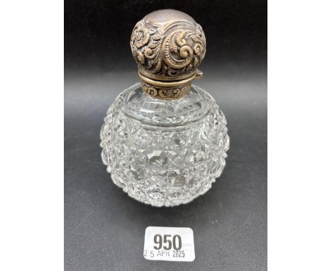 A circular scent bottle with stopper and embossed decoration with cut glass body, Birmingham 1906