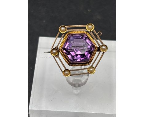 A antique fine amethyst and pearl hexagonal brooch