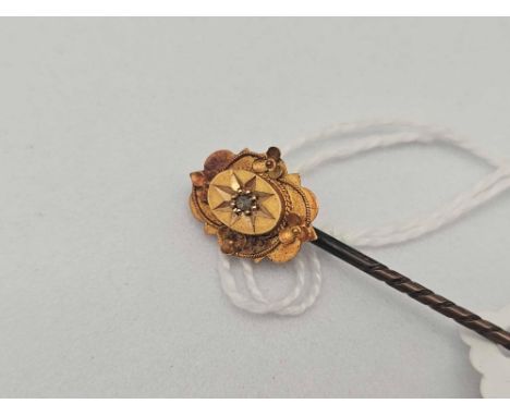 A diamond stick 15ct gold