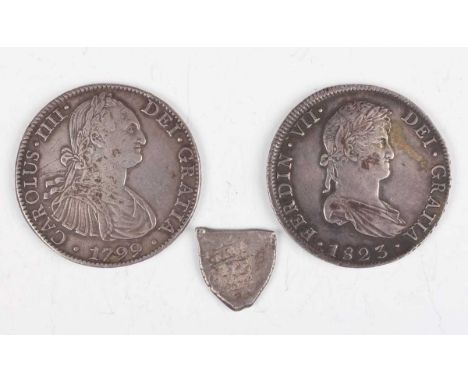 A group of three 18th and 19th century Spanish silver coins, comprising a Charles IV eight reales or pillar dollar 1799 Mexic