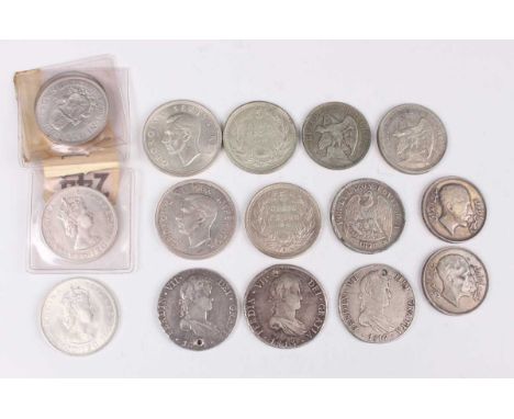 A collection of world silver and silver metal larger denomination coins, including two Iraq King Faisal silver two hundred fi