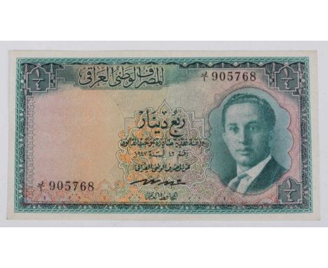 A scarce Iraq King Faisal II third issue quarter-dinar banknote 1947, obverse with portrait of the young king on a green and 