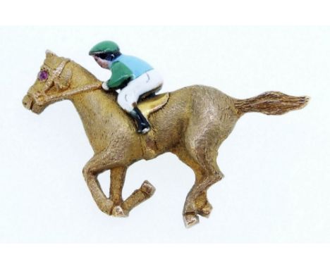 A 9ct gold horse and jockey brooch with enamel decoration and ruby eye by Crop &amp; Farr, 8g - 3.2cm long 