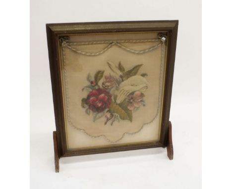 A Victorian textured woolwork embroidered firescreen 