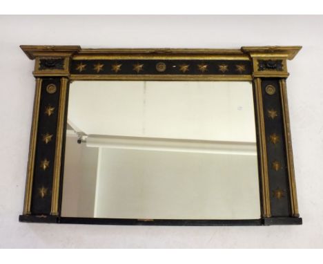 A Regency gilt ebonized over mantel mirror with star decoration - 99 x 61cm