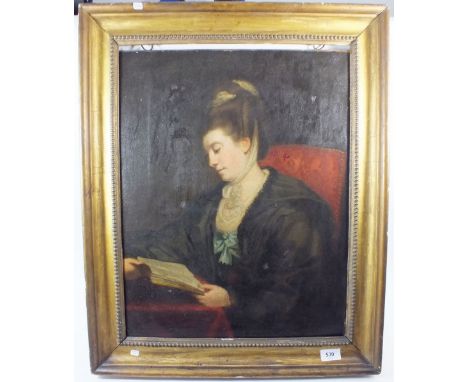 An early 19th century oil on canvas portrait of a woman seated reading a book 'Mrs Edmund Burke, Nee Nugent', 53 x 41cm, with