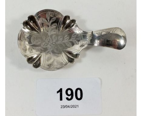 A Georgian silver caddy spoon with bright cut decoration, Birmingham 1825 by John Bettridge - tear to handle and collar 