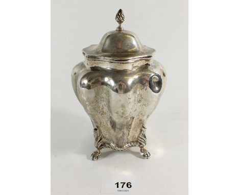 A late Victorian silver tea caddy in ribbed baluster shape on four lion paw feet, Chester 1900, 15cm tall, 265 grams 