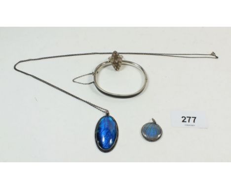 A silver and butterfly wing pendant, white metal pendant, 800 standard silver bangle and white metal ring 