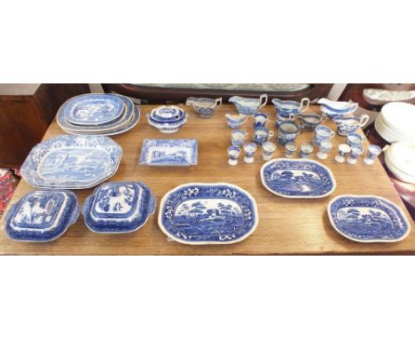 A large selection of blue and white china including a set of three Copeland Spode meat plates, ten egg cups , ten jugs, vario