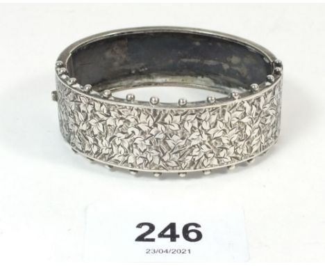 A Victorian silver bangle with engraved decoration 