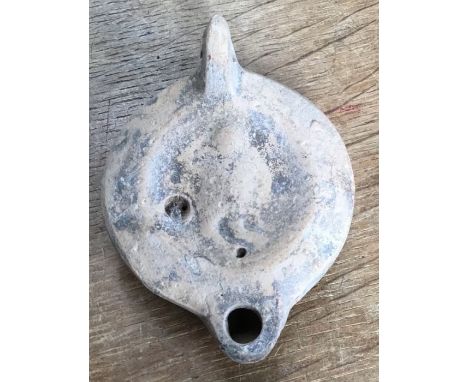Late Roman North African Grave Offering decorated oil lamp.&nbsp;Approximately 9cm long and 3.5cm high.