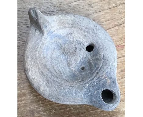 Late Roman North African Grave Offering decorated oil lamp. Approximately 11cm long and 5cm high.