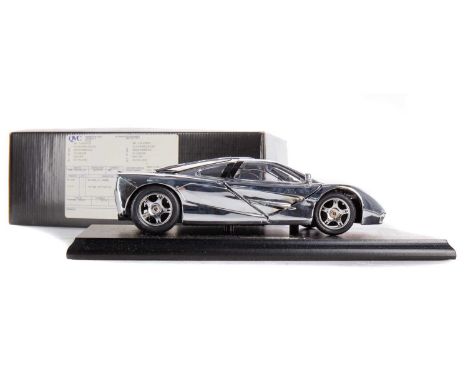 MCLAREN, CHROMIUM POLISHED 1:18 SCALE MODEL OF THE F1 MCLAREN presented on stand, with certificate and cleaning cloth, boxed