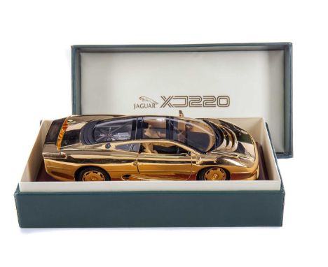 JAGUAR, GOLD PLATED 1:18 SCALE MODEL OF THE XJ 220 presented on stand, with certificate and booklet issued by GWILO Internati