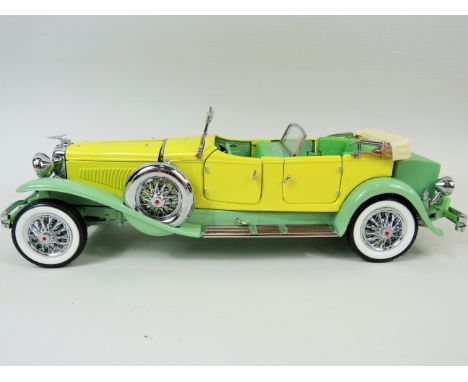 Franklin mint Die cast model of a Duesenberg Open topped car in Yellow,.Part original box. ex display condition. No box. See 