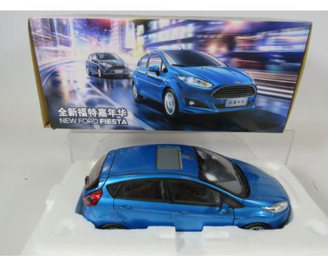 Ford Motor Company, 1:18 Scale Die Cast model of a Ford Fiesta. Original box and packaging.  Ex display condition. See photos