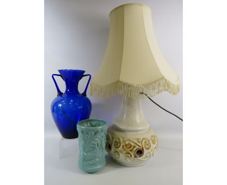 Large Double bulb Shelf pottery lamp with 3 light settings, a large twin handle blue glass vase and a Sylvac vase.