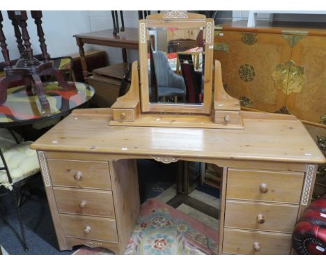 Knee hole bedroom dressing table with mirror above. Made in bleached weather effect pine with carved decorations.. H:30 x W:5