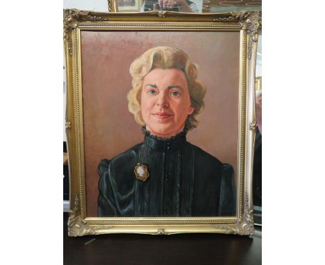 Nicely painted oil on canvas portrait of a lady in a Victorian style dress.  Housed in a gilt frame.   Measures 28 x 23 Inche