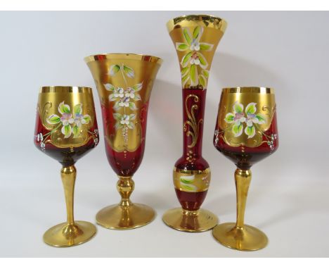 Selection Bohemian red glass vases and glasses gilt and enamel decorated.