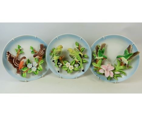 Three pretty 3D Ceramic Bird plates with wire wall hangers. See photos. 