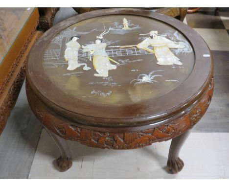 Circular low table raised on ball and claw feet with carved frieze around the perimiter. Centre table is detailed with Chines