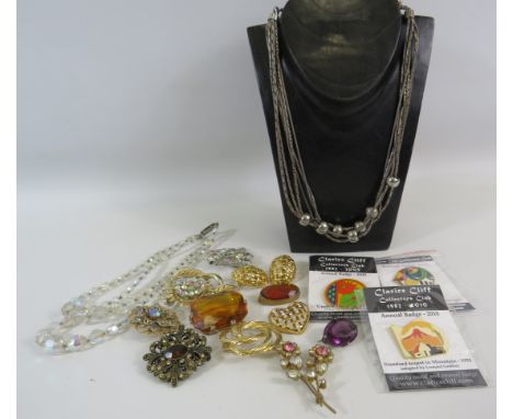 Selection of vintage Costume jewellery brooches and necklaces plus 3 Clarice Cliff badges.