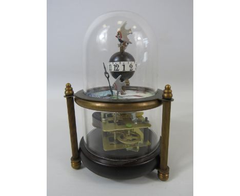 Novelty clock work fish tank clock in a glass dome in working condition.