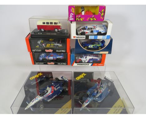 Collection of Boxed and Unused 1:43 Scale Die Cast sports and Racing cars.  See photos. 