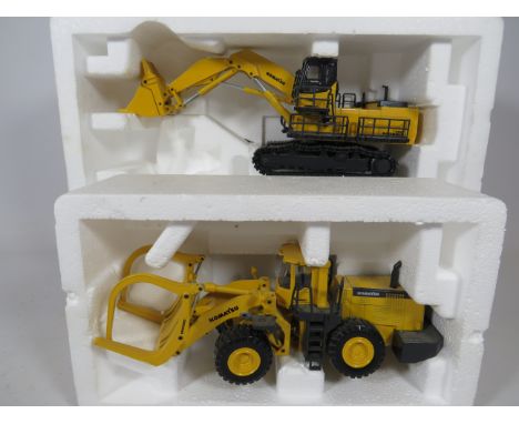 Joal Log Loader in Original box plus a Joal Material handler in original box . Both 1:50 Scale. Both in Ex Display condition.