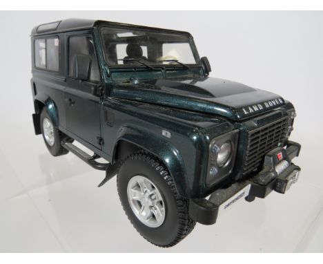 Kyosho 1:18 Scale Die Cast Model of a Landrover Defender 90 .  Original box and packaging. In Ex Display Condition.   See pho