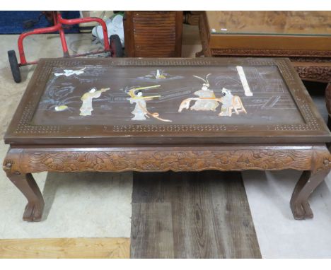 Beautifully carved Opium style table believed to have been brought from Thailand.  Raised on carved bracket feet with carved 