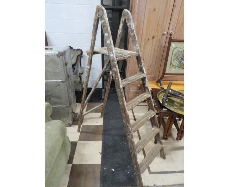 Pair of vintage step ladders. H:57 inches tall.   Strong condition. See photos.  S2