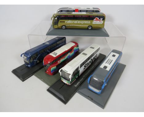 Six various model coaches on plinths.1:76 Scale.  No boxes. Ex display condition. See photos