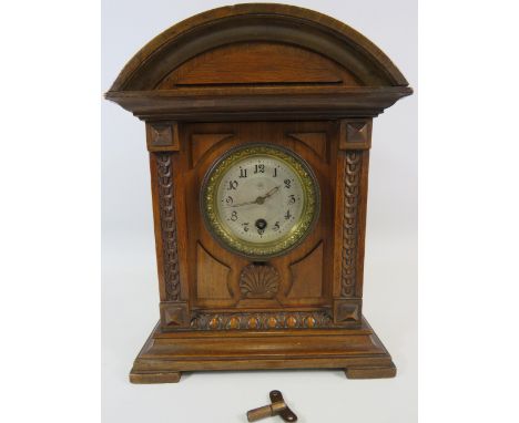 Vintage Junghams wooden mantle clock 10 3/4" tall and 8 3/4" wide. Needs attention to run.