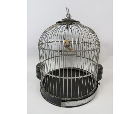 Vintage birdcage by Genykage. Original ceramic feeders with screw out bottom for cleaning. Hanging chain.  Measures 15 inches