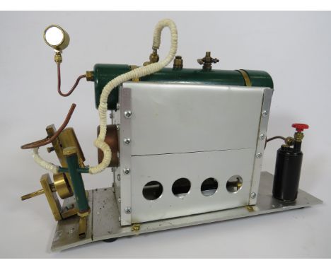 Double Tank steam engine with pressure gauge and gas fed boiler.  Hand made in working order. Measures 8 inches tall x 12 Inc