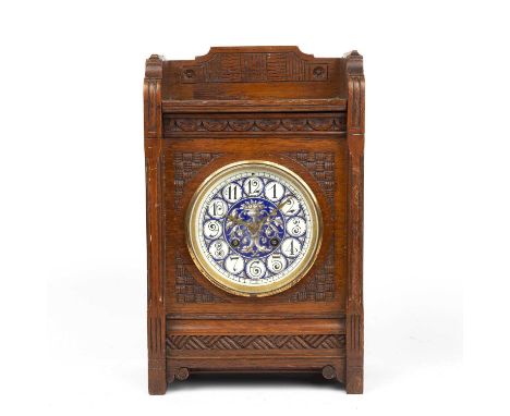 A late 19th century oak cased mantle clock with an enameled dial 20.5cm wide14cm deep 32.5cm high.untested includes pedulum. 