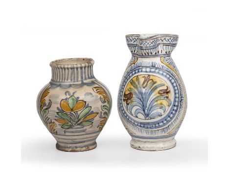 An antique Italian albarello 17cm high and an 18th century Tuscan jug 21.5cm high.