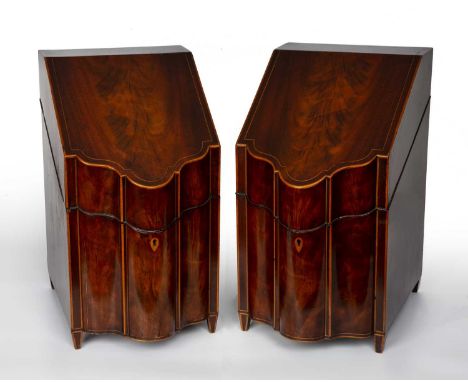 A pair of George III mahogany knife boxes with shaped fronts and square tapering feet, each 23cm wide x 30cm deep x 40.5cm hi
