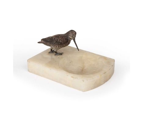 A cold painted bronze woodcock mounted on an onyx tray, overall 14cm wide x 8cm highMinor rim chips to the onyx tray