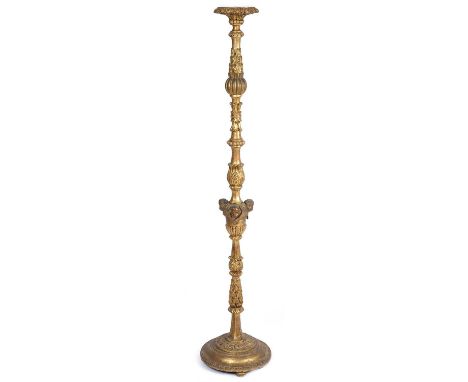 An antique gilded wooden standard lamp with Acanthus and cherub head decoration 32cm wide 148cm high