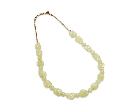 A pale green nephrite jade bead necklace on a metal chain
With round beads 13mm alternating carved beads of around 25mm, leng